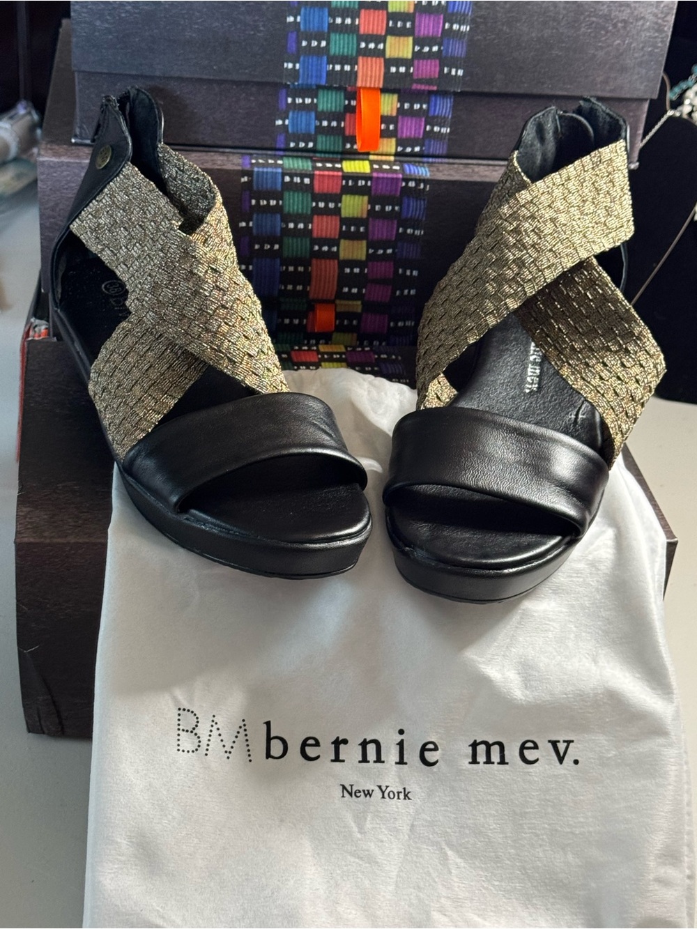 bernie mev. Black Leather Wedges with Gold Crisscross Straps